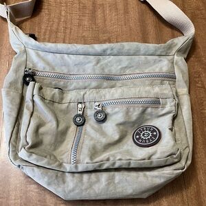Tan Crossbody Bag with Adjustable Strap and Durable Fabric